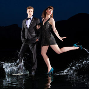 Karmin posing on water for nighttime photoshoot